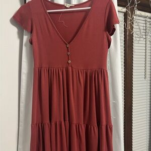 redish orange low cut tiered dress with buttons. midi dress